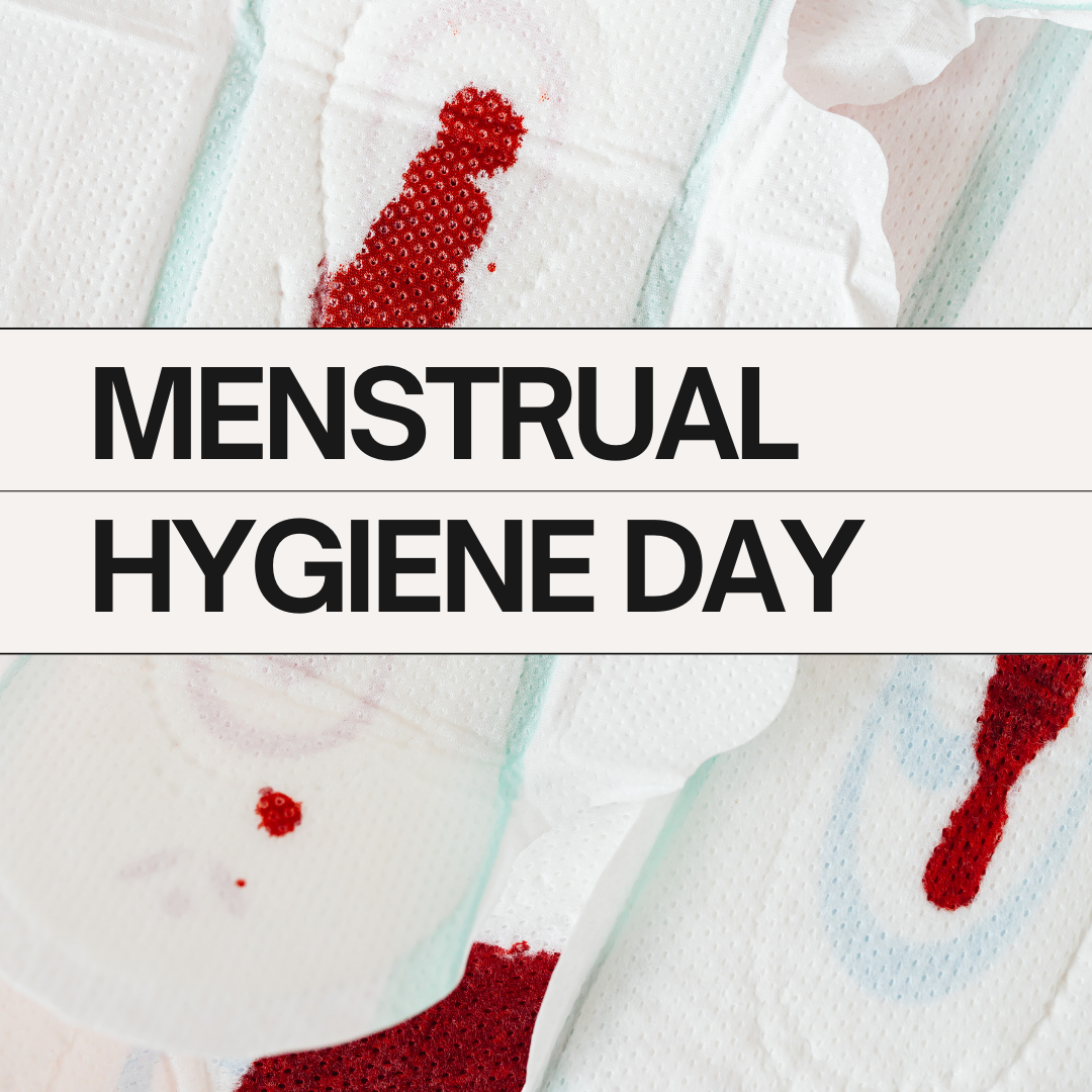 A photo of bloody pads with text in the front that says "Menstrual Hygiene Day"
